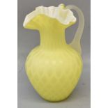 STYLE OF WEBB; a Burmese style yellow glass jug, height 22cm.