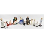 ROYAL DOULTON; a collection of twelve assorted figurines including 'The Carpenter', 'The Old Balloon