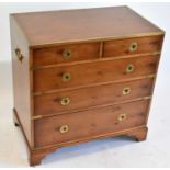A reproduction yew and brass mounted military style chest of two short and three long drawers on