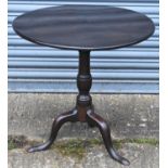A 19th century mahogany tilt-top table, the circular top on turned column and tripod supports,