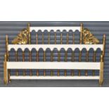 A decorative gilt and white painted double bedstead, width 160cm.