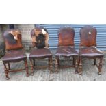 A set of four early 20th century oak and leather upholstered dining chairs for restoration.