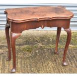 A George II mahogany tea table, the shaped fold over top on cabriole gateleg supports, width 82cm.