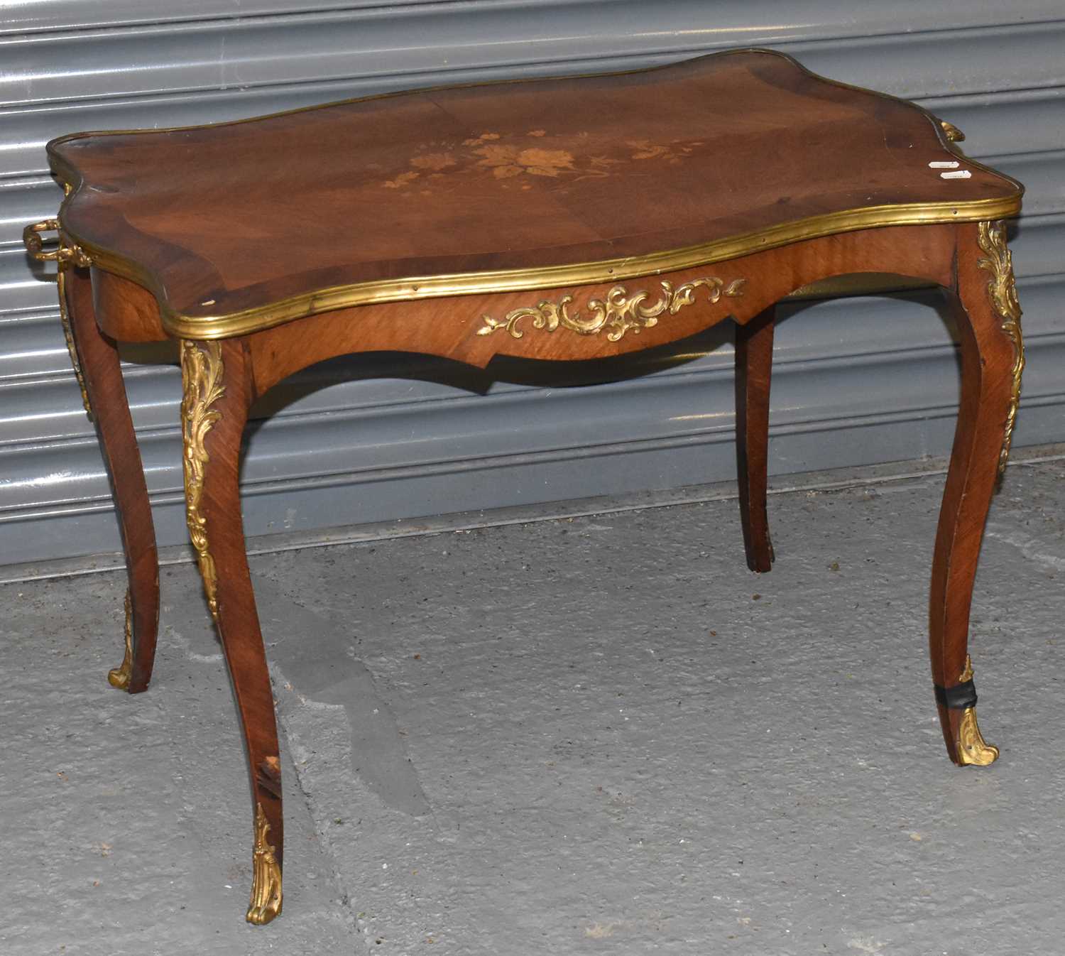 A late 19th century French kingwood and inlaid occasional table with serpentine shaped top, gilt