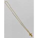 An 18ct gold filigree cross on 9ct chain, combined approx 4.7g.