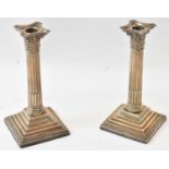 A pair of Edward VII hallmarked silver Corinthian column form candlesticks, Sheffield 1902, height