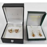 A pair of 9ct gold ear studs modelled as fox heads with red stone eyes, approx 3g, and a pair of 9ct