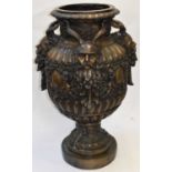 A huge 20th century bronze urn of baluster form, decorated with satyrs, height 95cm.