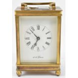 An early 20th century brass cased carriage clock, the white dial marked De La Grense, height 12.