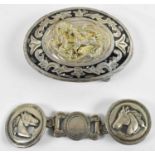 A silver and niello enamel oval belt buckle decorated with horses, probably South American, 6.5 x