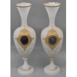 A pair of Victorian opaque glass vases each inset with an oval cameo, height 30cm.