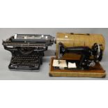 A vintage Underwood 14 typewriter and a Harris 9H sewing machine (2).