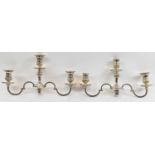 THOMAS BRADBURY & SONS; a pair of three branch candelabra tops, height 20cm, 49ozt/1534g.Condition