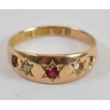 A 15ct yellow gold ruby and seed pearl five stone ring (two stone missings), size M, approx 1.7g.