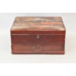 A Japanese red lacquer vanity box with hinged lid above drawer, width 30cm.