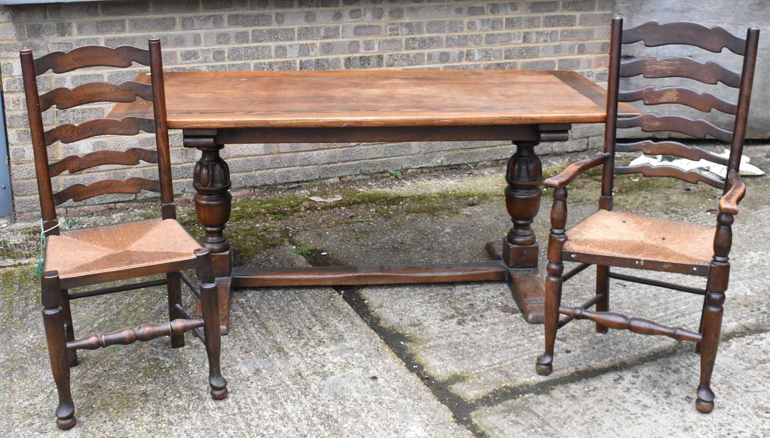 An oak rectangular refectory table on baluster turned supports 174 x 82cm, and a set of six rush