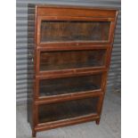 An oak four tier stacking bookcase, height 140cm, width 87cm.