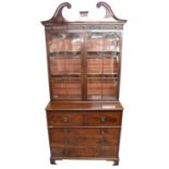 A George III mahogany secretaire bookcase, with pair of glazed doors above fitted secretaire