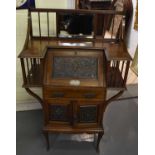 A late Victorian mahogany bureau of small size, with bevelled mirror inset to the back above fall