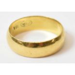 A yellow metal wedding band stamped '18A', size M, 4.43g