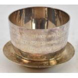 An Elizabeth II hallmarked silver bowl with year 2000 markings, diameter 9cm, also a small alms