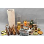 A group of collectors' items including vintage glass apothecary and other bottles, tins, spoons,