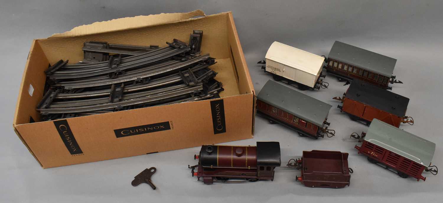 A Hornby OO gauge clockwork locomotive 5600, six assorted carriages/wagons, and a quantity of