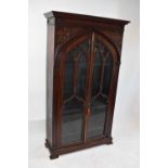 JAMES WINTER; a good early 19th century mahogany freestanding Gothic bookcase with pair of glazed