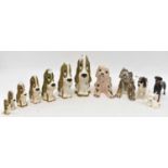 A collection of ceramic dogs including seven graduated Szeiler, two Rye Pottery, three Beswick (