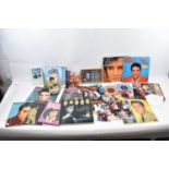 ELVIS PRESLEY INTEREST; a collection of LPs and 45 RPM singles, a set of framed Elvis Presley