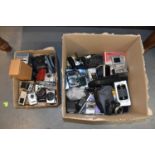 A large quantity of digital and vintage cameras including an Olympus Mju Zoom 140, Nikon, Canon, and