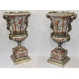 A pair of huge decorative Imari style baluster form urns, with silvered metal and figural mounts,