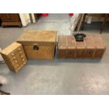 Two cabin/travelling trunks, one in wicker with canvas interior, the second wooden bound with