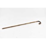 A bamboo measuring stick, the brass base unscrewing to reveal a brass tipped stick, with horn