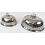 Two large graduated silver plated meat domes, largest width 48cm, height 26cm.