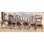 A group of five chairs including clerk's chair, bar back chair, bentwood chair, and two spindle back