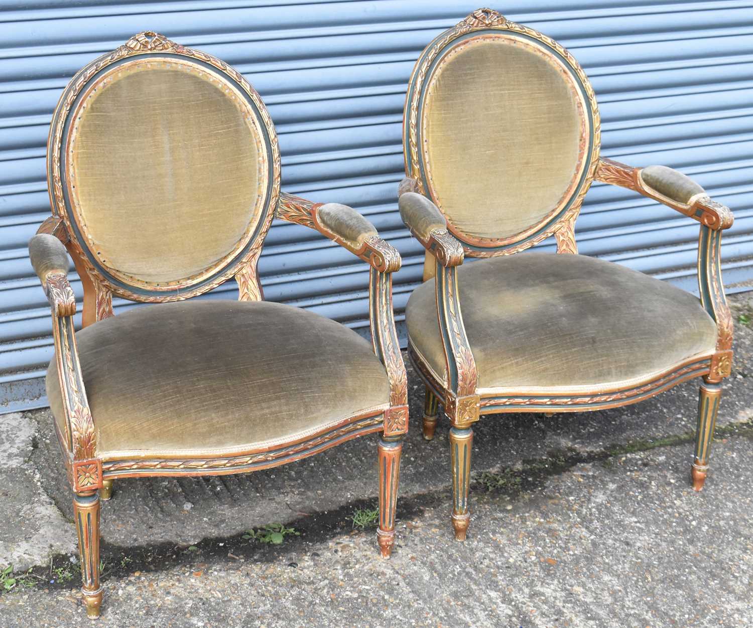 A pair of late 19th century French style giltwood elbow chairs (2).