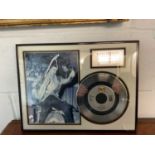 An Elvis Presley commemorative gold record/disc 'Don't be Cruel', framed with image of Elvis and