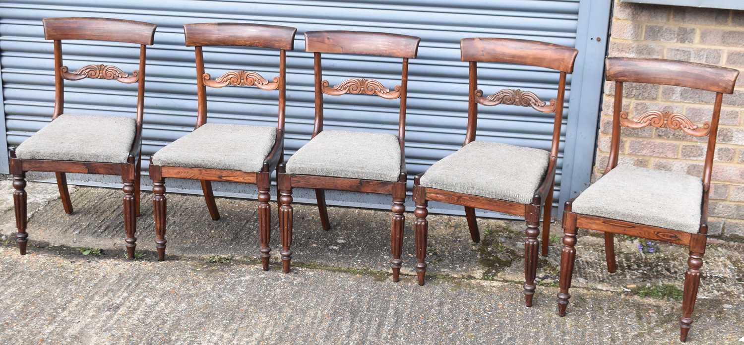 A set of five Victorian rosewood bar back dining chairs with upholstered drop-in seats (5).