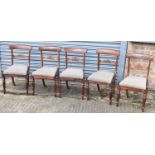 A set of five Victorian rosewood bar back dining chairs with upholstered drop-in seats (5).