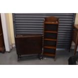 A mahogany and satinwood crossbanded bookcase of small proportions and a mahogany Sutherland