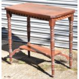 A early 20th century Gothic style two tier side table on turned legs, height 70cm.