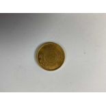 An Eastern gold coin, approx 8g.