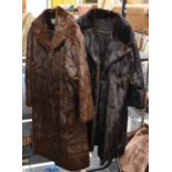 Two long fur coats, possibly mink.