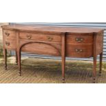 A large 19th century mahogany sideboard, the crossbanded and boxwood strung top above two central