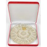 An ornate white metal filigree plate with applied yellow metal eagle insignia, diameter 18cm, approx