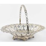 MARTIN, HALL & CO; a Victorian hallmarked silver pierced basket with handle, Sheffield 1890,