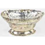 COOPER BROTHERS & SONS LTD; a George V hallmarked silver pierced basket decorated with fruit,
