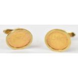 A pair of 14ct yellow gold cufflinks set with gold Pesos, approx 11.8g.