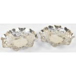 WILLIAM ADAMS LTD; a pair of George V hallmarked silver pierced bonbon dishes, Birmingham 1933,